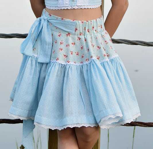 Bonnie twirl skirt with yoke and a gathered circle skirt. With gorgeous lace trim and generous back ties, pdf sewing pattern by frocks and frolics.