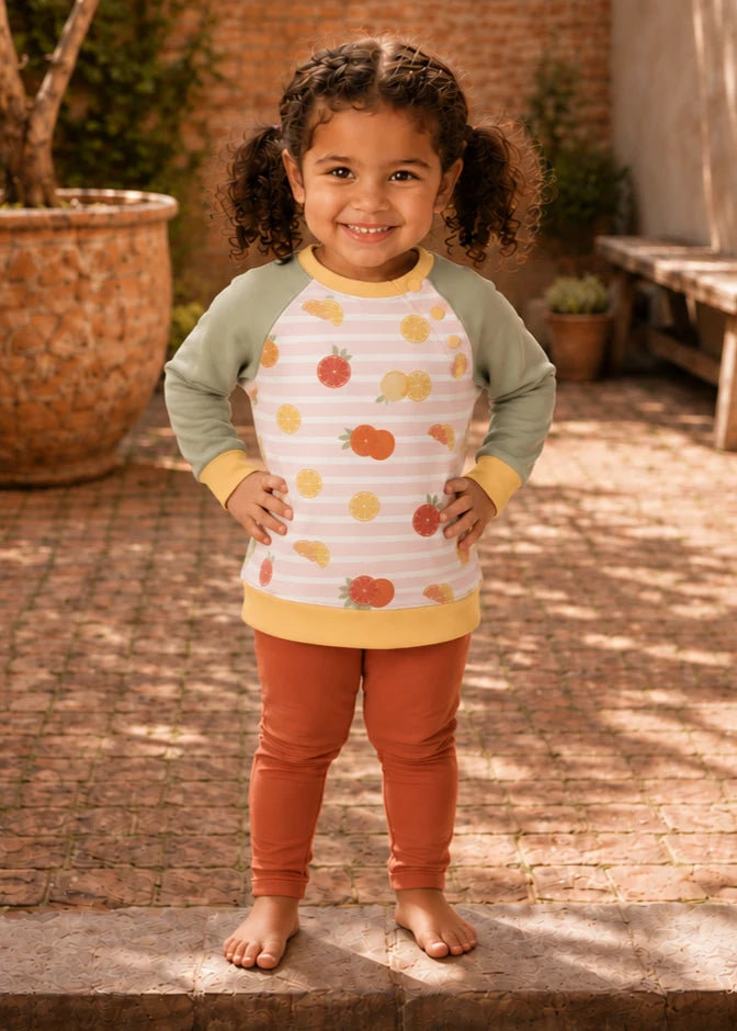 Bubble Gum Joggers & Jelly Bean Sweater patterns – girl in autumn print raglan and rust joggers, front view