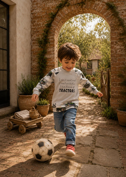Bubble Gum Joggers and Jelly Bean Sweater patterns – boy in printed raglan and jeans playing football outdoors
