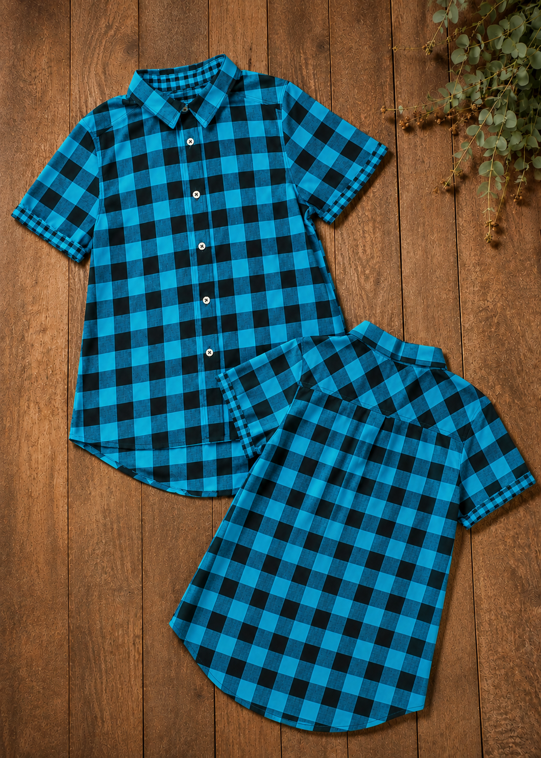 Flat lay of a teal and black plaid Cool Shirt showing both the front button placket and back view