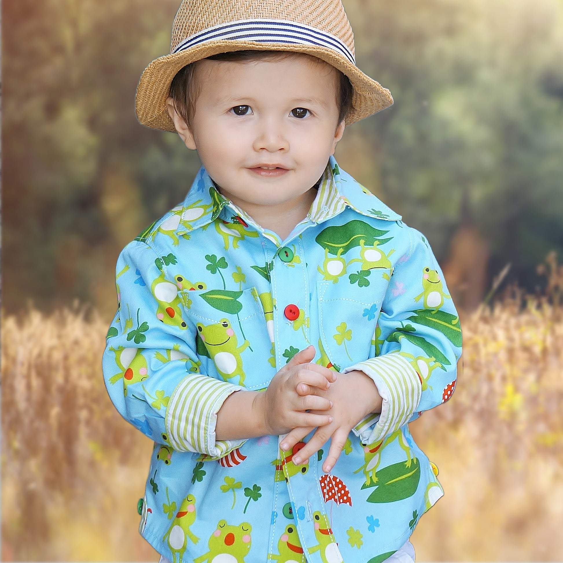 Cool shirt, pdf sewing pattern for a button down shirt by Frocks & Frolics.  The shirt has a cute frog print by Michael Miller fabrics. The pattern comes with a video guide for every step.
