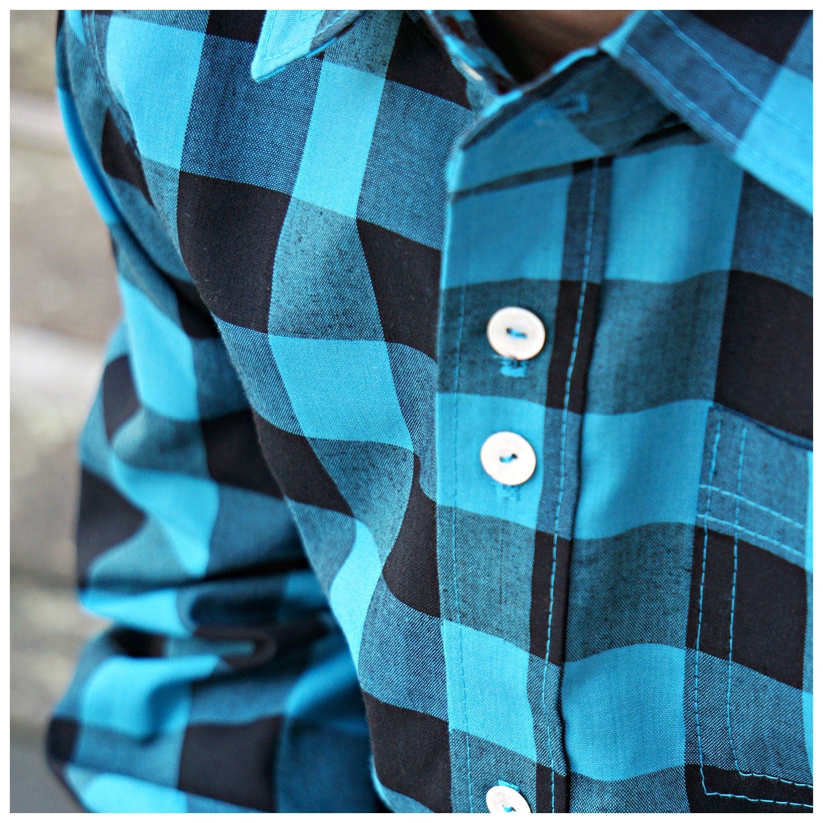 Cool shirt, pdf sewing pattern for a button down shirt by Frocks & Frolics.  High low hem feature. Includes a video sewing course explaining every step in detail. Close up of the placket.