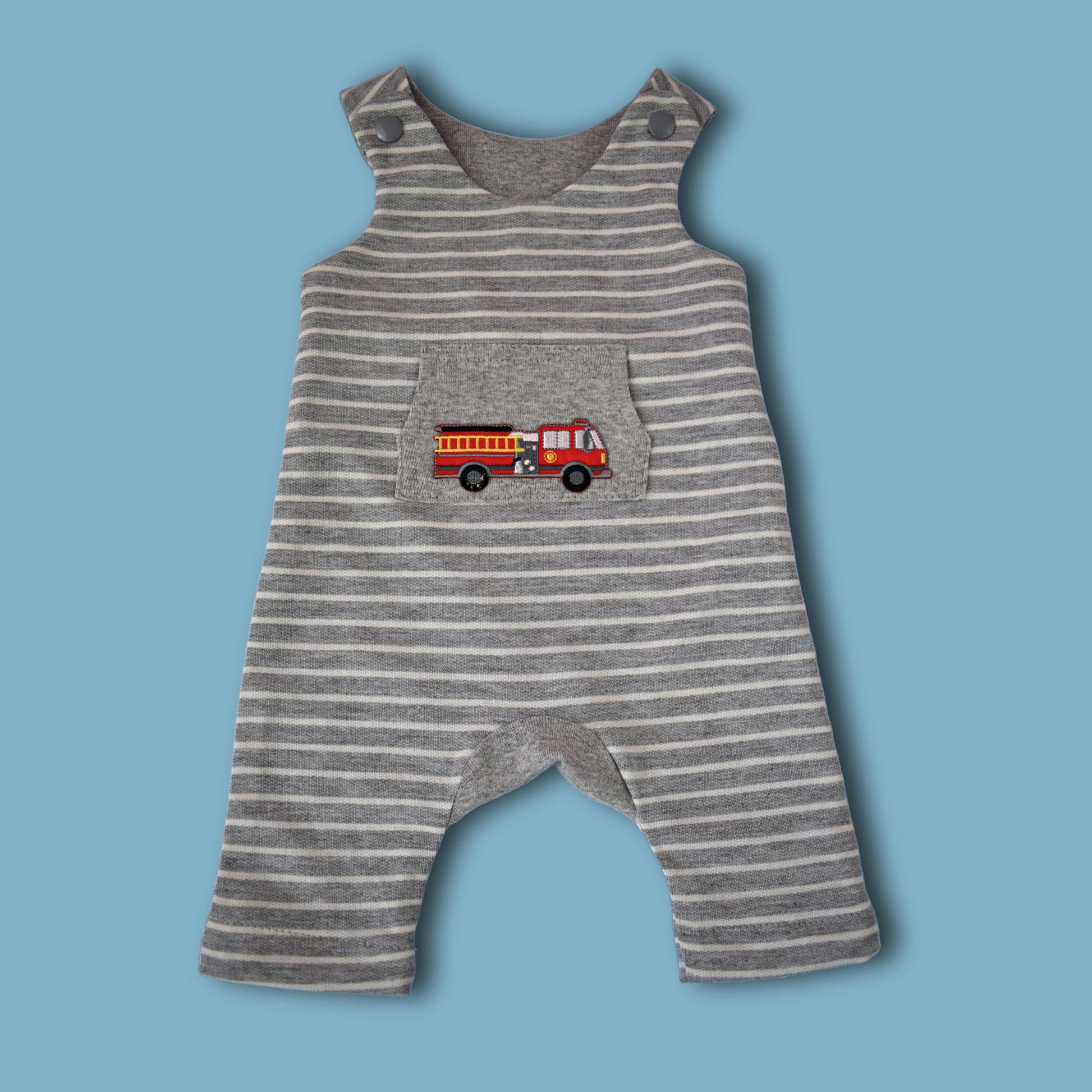 Dungies, baby romper pdf sewing pattern by Frocks & Frolics. For four way stretch interlock jersey. With gusset. Front pocket and dungaree closure. Comes with free video tutorial.