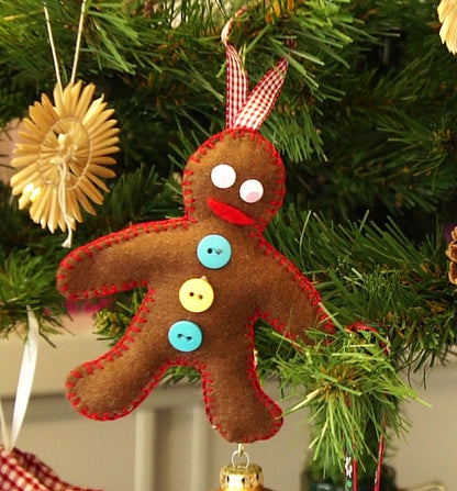 Felt gingerbread man ornament on a Christmas tree