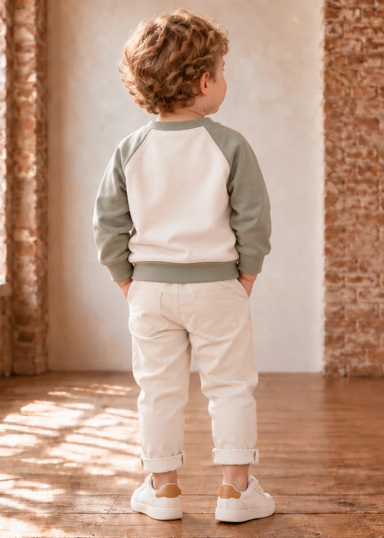 Jelly Bean Sweater sewing pattern – sage and cream raglan sweatshirt on a boy, back view