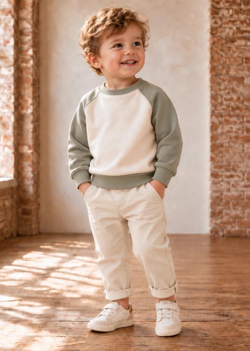 Jelly Bean Sweater sewing pattern – boy in sage and cream raglan sweatshirt, front view