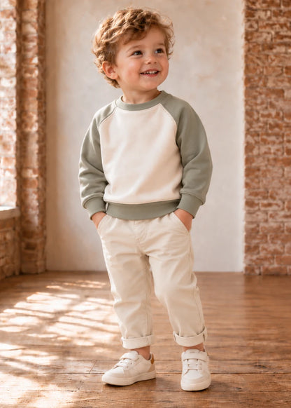 Jelly Bean Sweater sewing pattern – boy in sage and cream raglan sweatshirt, front view