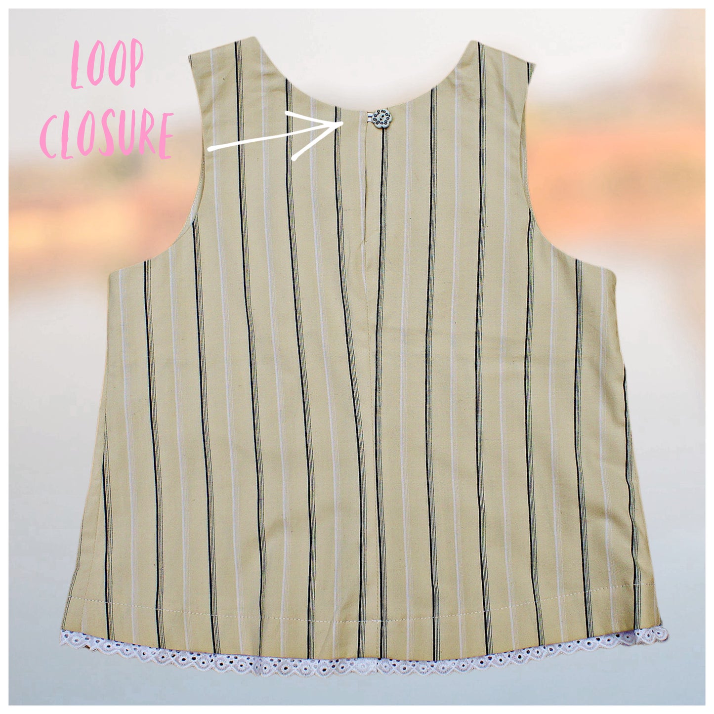 Pretty sleeveless summer dress with front pleats which open out. A-line shape, knee length. Sewing pattern and free video tutorial by Frocks & Frolics. 