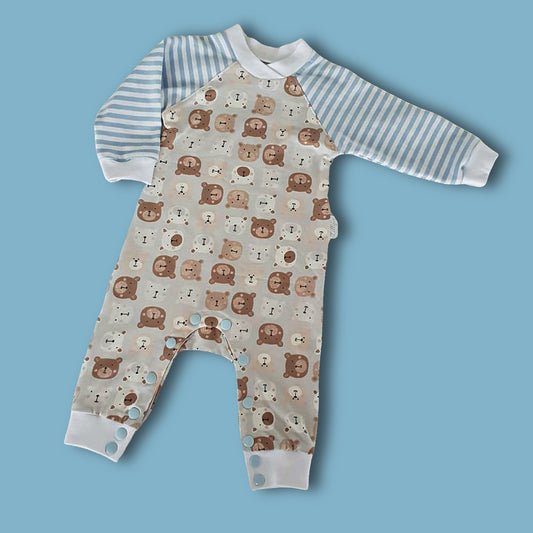 Lollipop romper, pdf sewing pattern by frocks and frolics. Raglan sleeves and full length legs with cuffs. Gusset in the inner leg seam and KamSnap closure.Teddybear print. Comes with video tutorial.