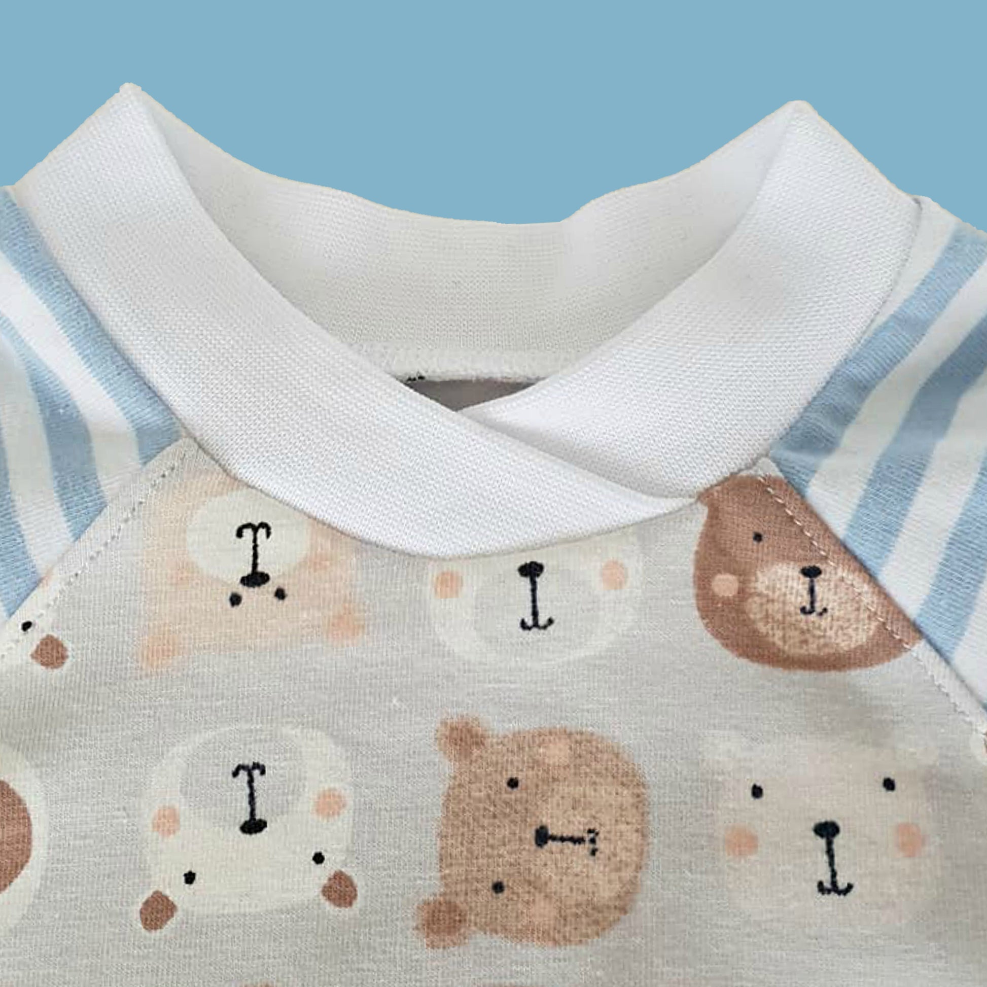 Lollipop romper, pdf sewing pattern by frocks and frolics. Raglan sleeves and full length legs with cuffs. Gusset in the inner leg seam and KamSnap closure.Teddybear print. Comes with video tutorial.