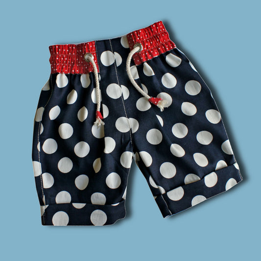 Maisy shorts pdf sewing pattern by Frocks & Frolics. Blue and white print with belt loopes, ties, side pockets and back patch pockets. The pattern includes video tutorials for every step.