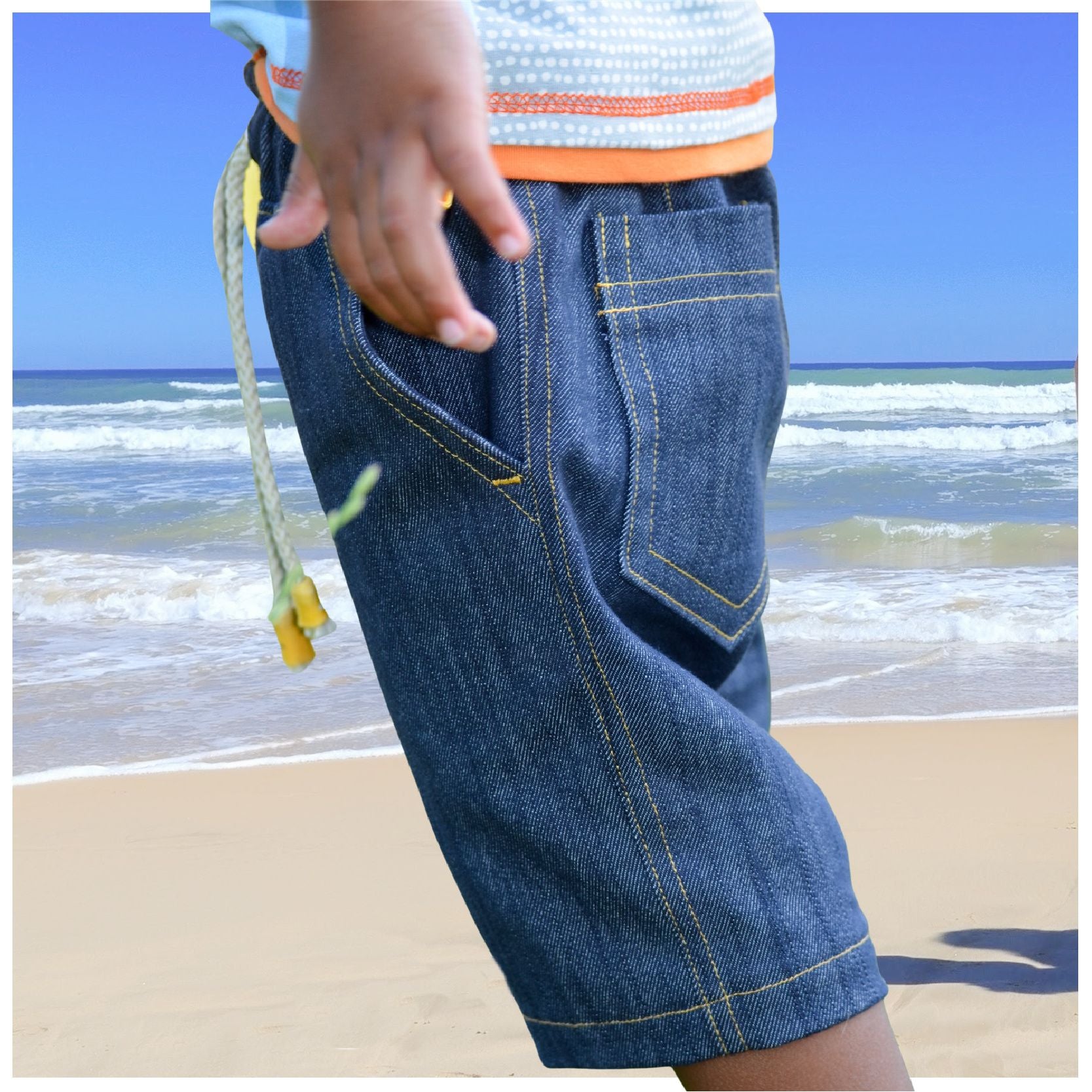 Oscar shorts, pdf sewing pattern by frocks and frolics, boys slacks, Bermuda shorts, age 1-14. Shorts have side pockets an elasticated waist and contrast turn up.