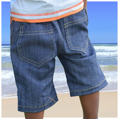 Oscar shorts, pdf sewing pattern by frocks and frolics, boys slacks, Bermuda shorts, age 1-14. Shorts have side pockets an elasticated waist and contrast turn up. Back view.