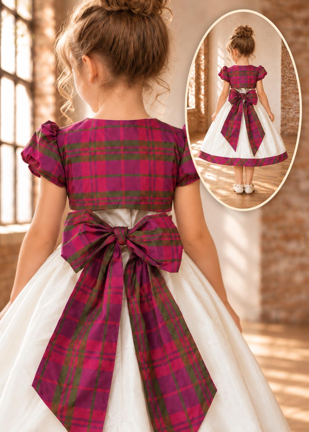 Frocks & Frolics Classic Bolero sewing pattern – back view of cream dress with magenta plaid bolero and bow