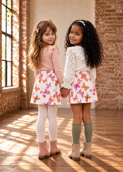 Frocks & Frolics Jutta skirt sewing pattern – two girls in white butterfly print skirts