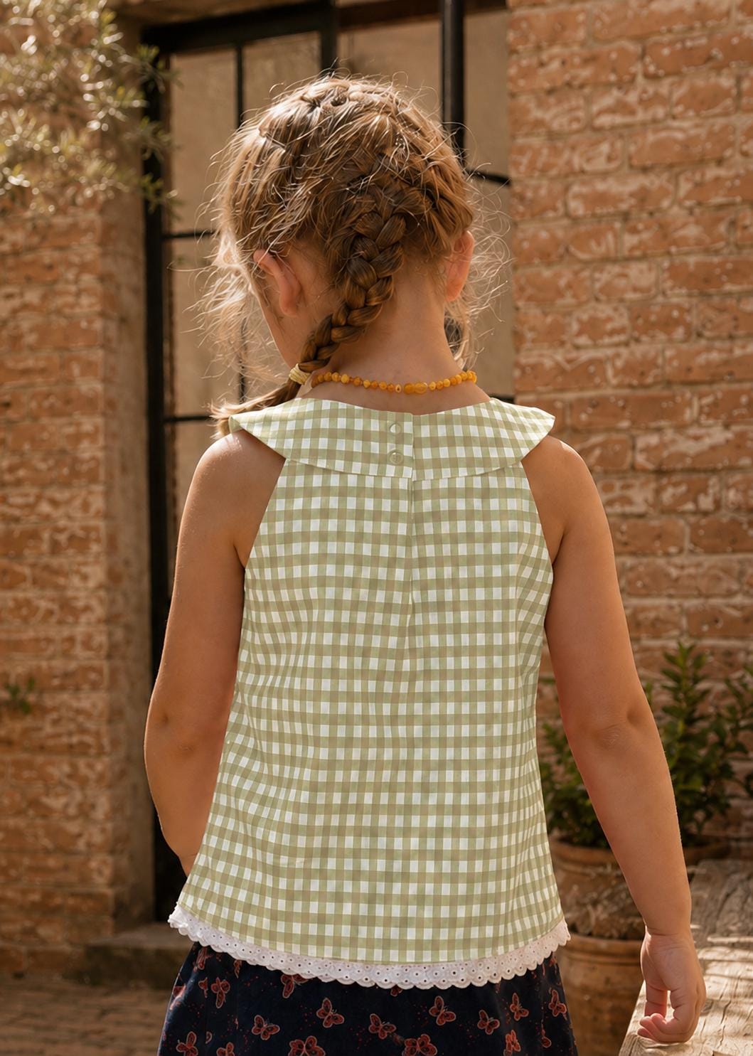 Frocks & Frolics Kitty top sewing pattern – back view of sage gingham top with flat collar and button closure
