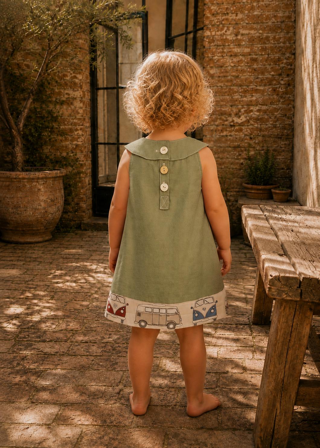 Frocks & Frolics Kitty dress sewing pattern – back view of sage green dress with button placket and camper van hem band