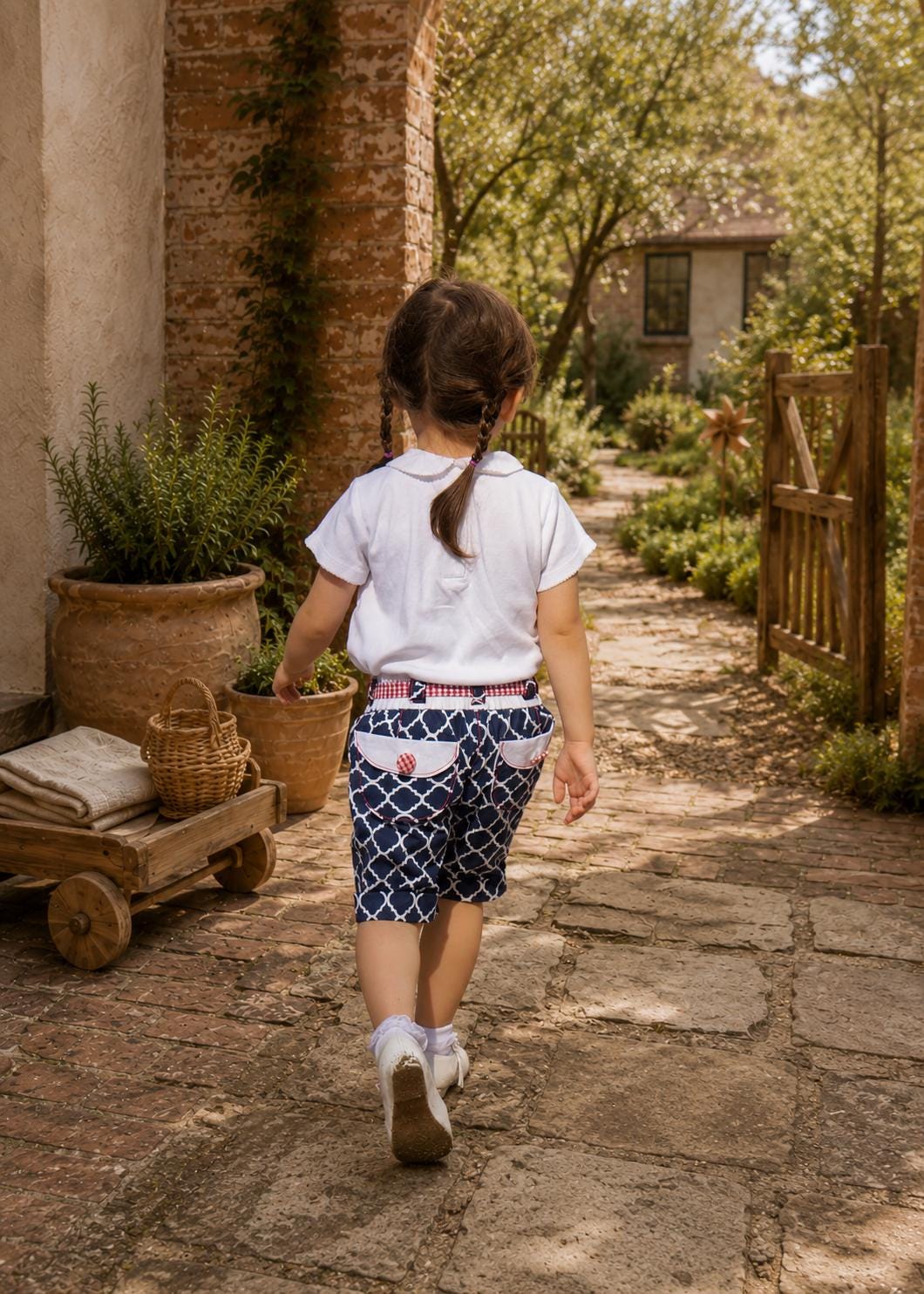 Frocks & Frolics Maisy shorts sewing pattern – back view of navy print shorts with gingham waistband and pockets