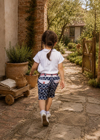 Frocks & Frolics Maisy shorts sewing pattern – back view of navy print shorts with gingham waistband and pockets