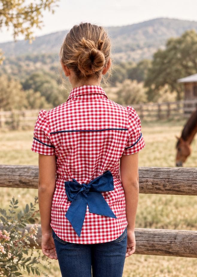 Frocks & Frolics Western Blouse sewing pattern – back view of red gingham blouse with navy piping and bow