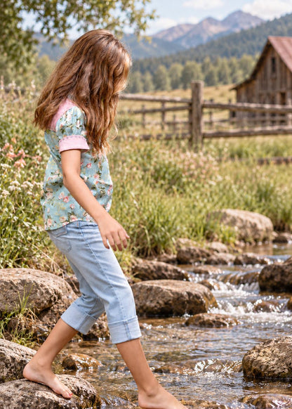 Frocks & Frolics Western Blouse sewing pattern – rose print blouse with pink cuffs and denim capris