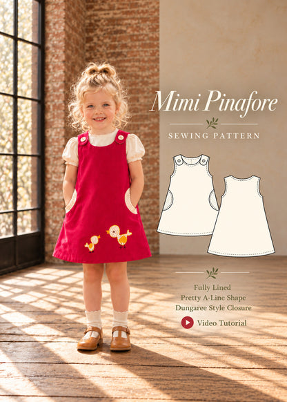 Mimi Pinafore dress PDF sewing pattern for girls. Girl wearing a red corduroy pinafore with bird appliqué and round side pockets, shown with front and back technical drawings. Fully lined, A-line shape, dungaree style closure, video tutorial.